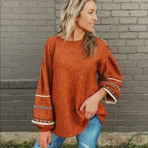 Adorable oversized sweater with balloon sleeve.
